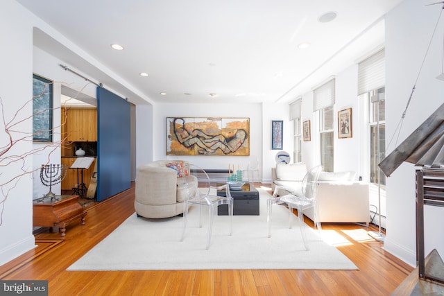 living room with recessed lighting and wood finished floors