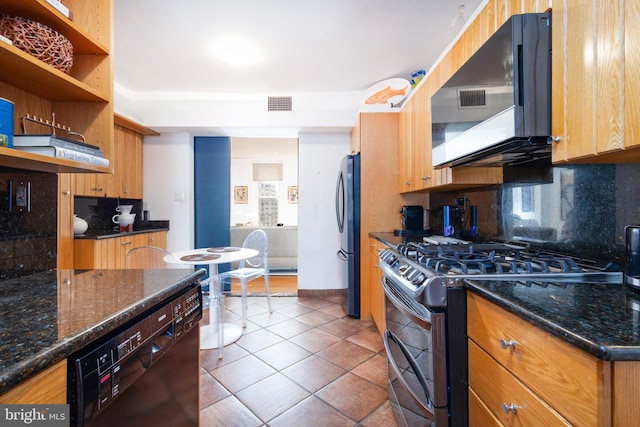 kitchen featuring visible vents, tile patterned flooring, appliances with stainless steel finishes, and backsplash