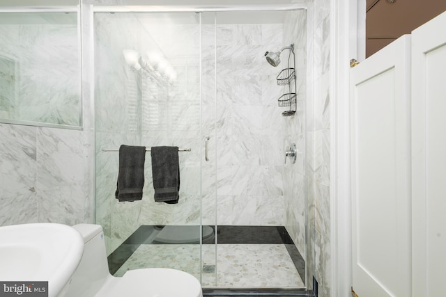 full bath with toilet and a shower stall