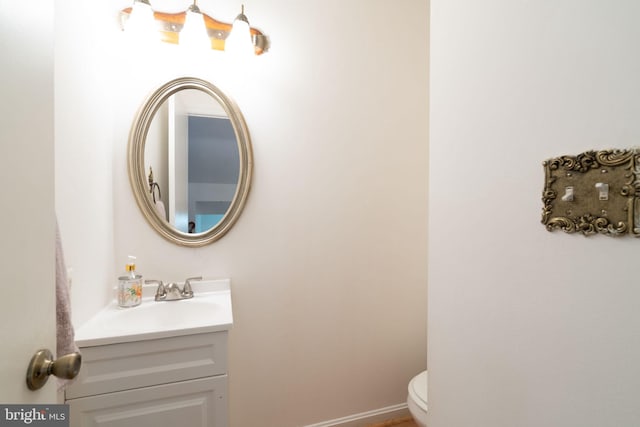 bathroom with toilet and vanity