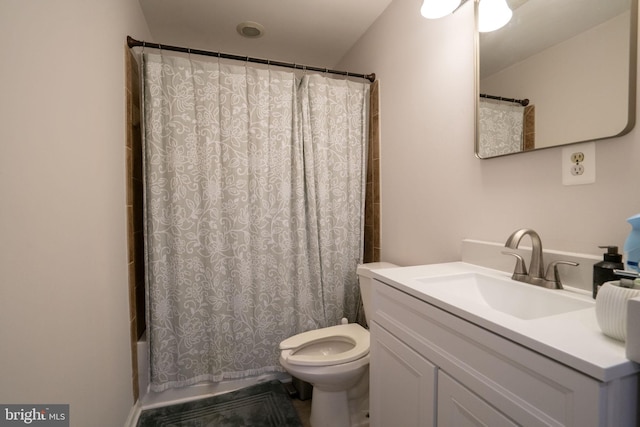 bathroom featuring toilet, shower / bath combo, and vanity