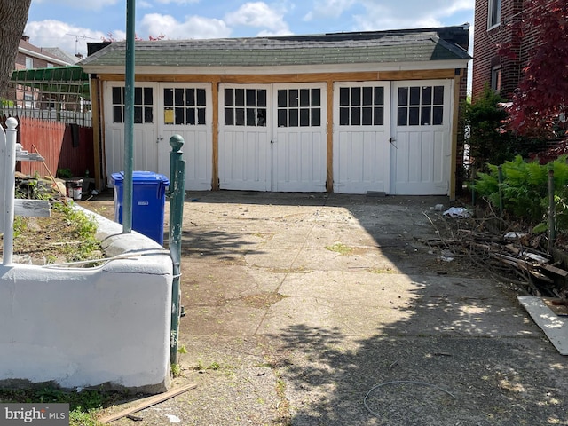 garage with fence