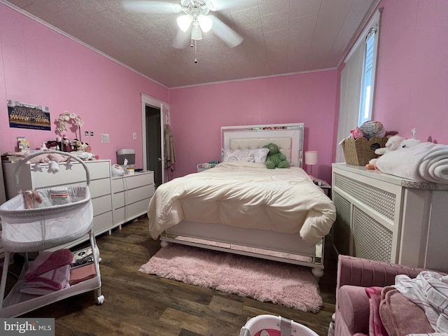 bedroom with a ceiling fan, ornamental molding, and dark wood-type flooring