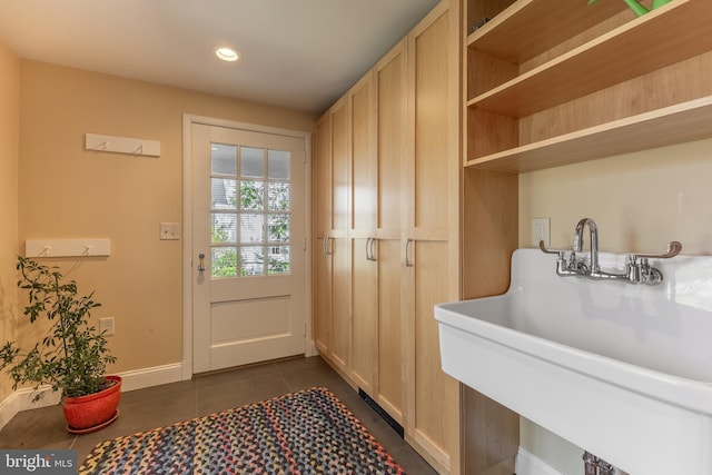 465 Hillcrest Ave, State College, PA 16803 - interior space featuring dark tile patterned floors, baseboards, recessed lighting, and a sink