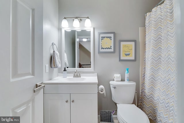 full bathroom with vanity and toilet