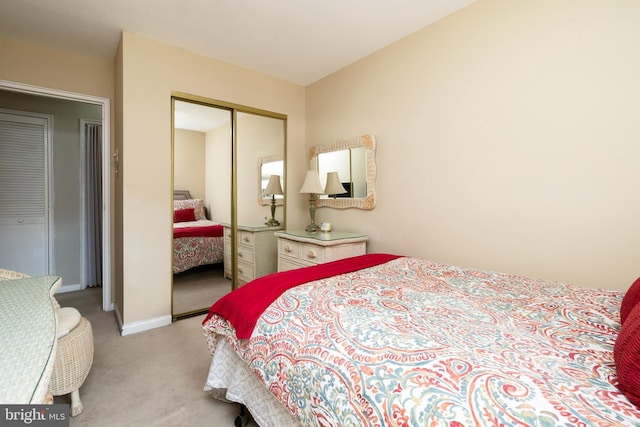 carpeted bedroom featuring a closet