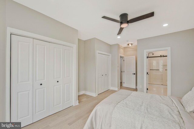 bedroom featuring light wood-style floors, two closets, recessed lighting, baseboards, and ensuite bathroom