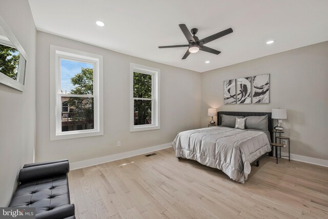 bedroom with visible vents, light wood-style floors, baseboards, ceiling fan, and recessed lighting