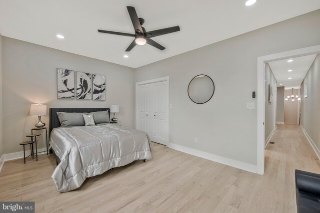 bedroom with recessed lighting, baseboards, a closet, and light wood-style floors