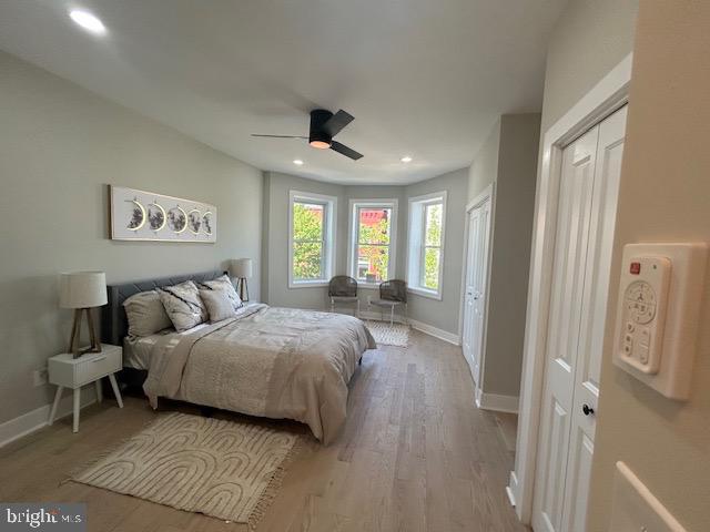 bedroom featuring baseboards, recessed lighting, a ceiling fan, and wood finished floors