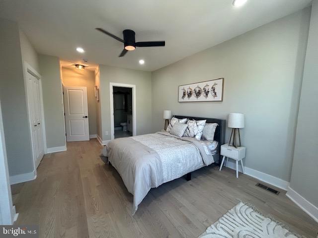bedroom featuring light wood-style floors, recessed lighting, baseboards, and a ceiling fan