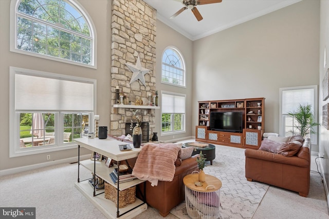1 Arbor Lea Cir, Doylestown, PA 18901 - carpeted living room with a high ceiling, crown molding, ceiling fan, a stone fireplace, and baseboards