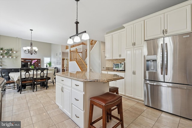 1 Arbor Lea Cir, Doylestown, PA 18901 - kitchen with stainless steel fridge with ice dispenser, light tile patterned floors, backsplash, a kitchen island, and a chandelier