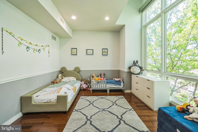 bedroom featuring recessed lighting, baseboards, visible vents, and wood finished floors