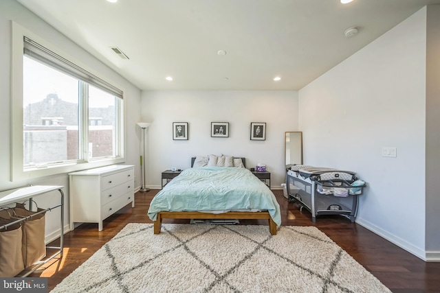 bedroom featuring baseboards, recessed lighting, wood finished floors, and visible vents