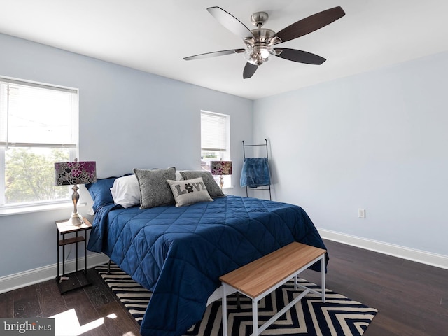 bedroom featuring baseboards, a ceiling fan, and wood finished floors