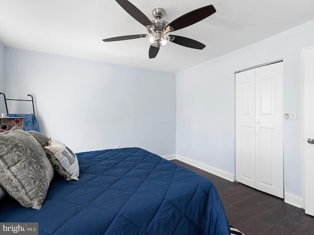 bedroom featuring a ceiling fan, baseboards, and wood finished floors