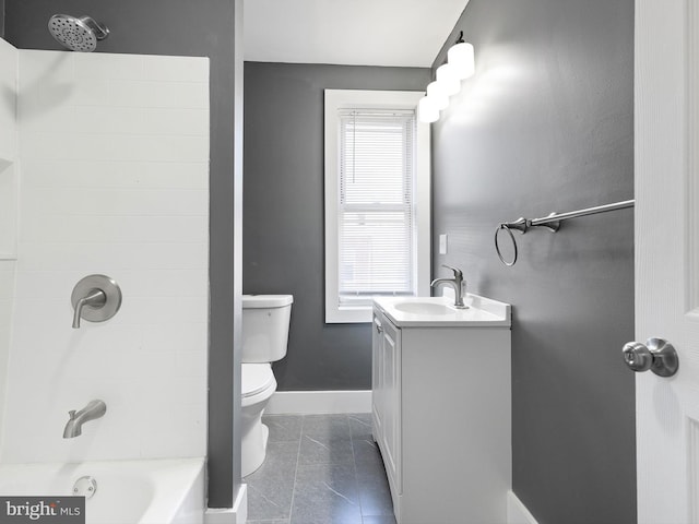 bathroom featuring vanity, toilet, baseboards, shower / bathing tub combination, and tile patterned floors