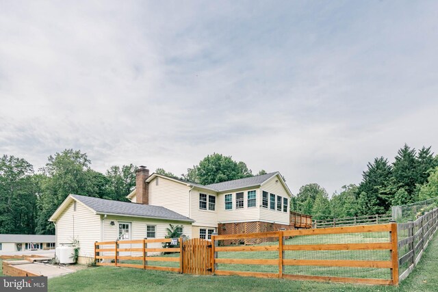 view of front of home featuring a chimney