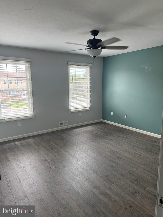 661 Hartman Ave, Hanover, PA 17331 - unfurnished room with baseboards, a ceiling fan, dark wood-type flooring, and visible vents