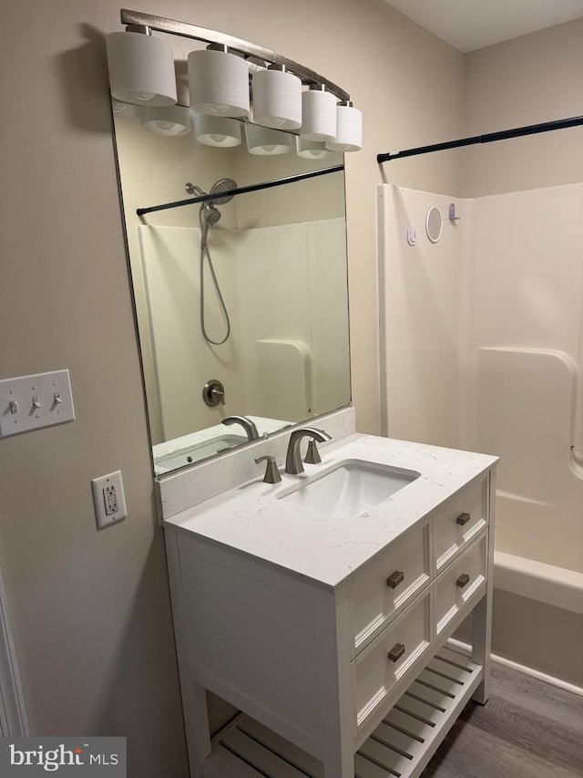 661 Hartman Ave, Hanover, PA 17331 - bathroom featuring vanity, shower / bathtub combination, and wood finished floors