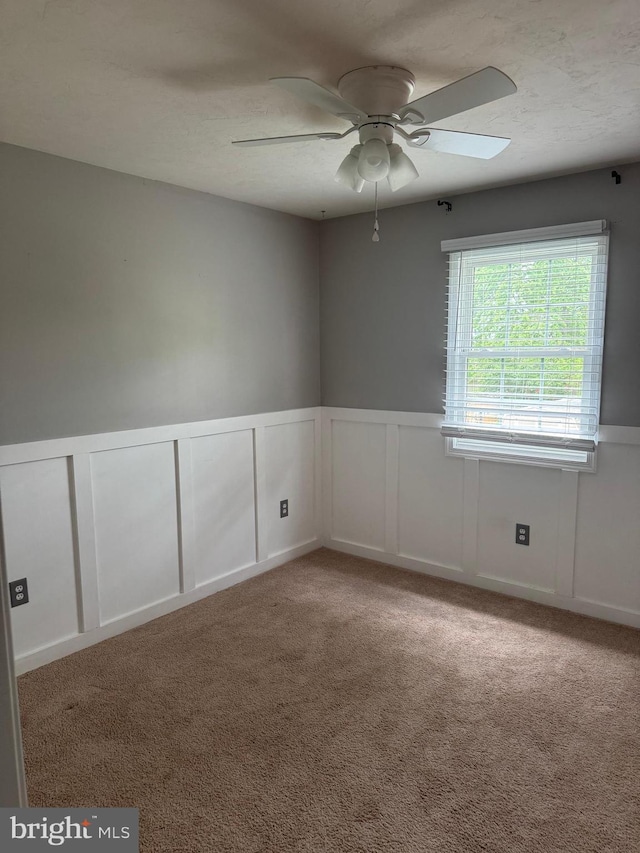 661 Hartman Ave, Hanover, PA 17331 - empty room featuring a decorative wall, ceiling fan, and a wainscoted wall