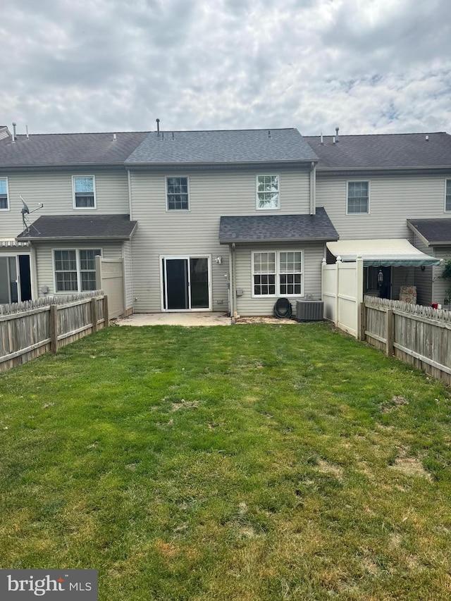 661 Hartman Ave, Hanover, PA 17331 - back of house with a patio, a fenced backyard, central air condition unit, and a yard