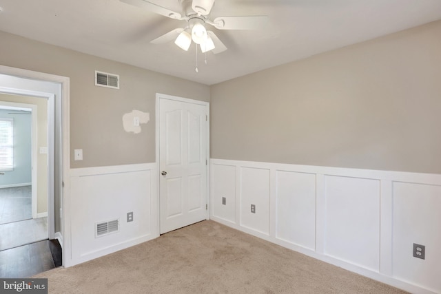 661 Hartman Ave, Hanover, PA 17331 - spare room featuring ceiling fan, visible vents, and a wainscoted wall