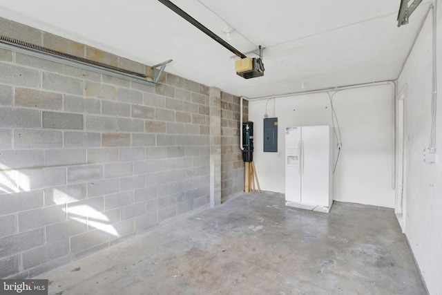661 Hartman Ave, Hanover, PA 17331 - garage featuring concrete block wall, electric panel, and a garage door opener