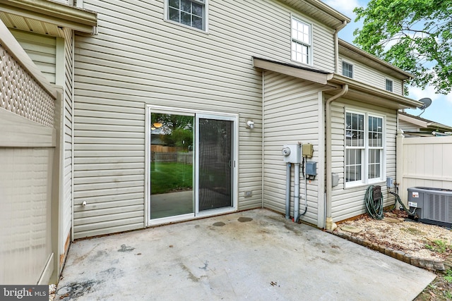 661 Hartman Ave, Hanover, PA 17331 - back of property with a patio, fence, and central AC