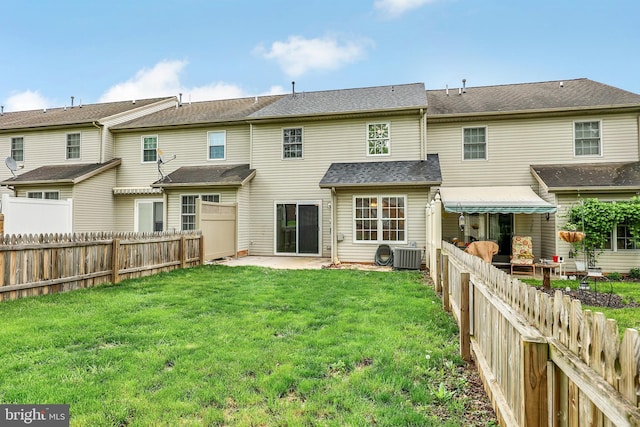 661 Hartman Ave, Hanover, PA 17331 - back of property with a yard, central AC unit, a patio area, and a fenced backyard