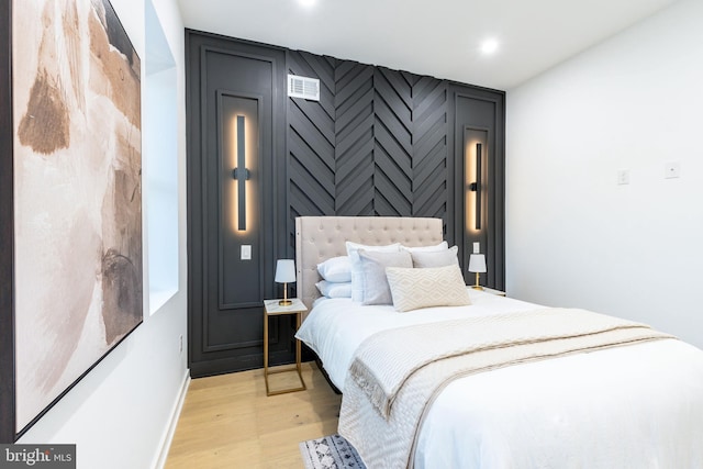 2074 E Birch St, Philadelphia, PA 19134 - bedroom featuring recessed lighting, baseboards, an accent wall, and light wood-type flooring