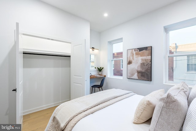 2074 E Birch St, Philadelphia, PA 19134 - bedroom with multiple windows, a closet, recessed lighting, and light wood-style flooring