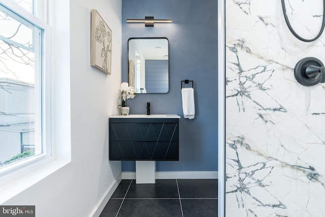2074 E Birch St, Philadelphia, PA 19134 - bathroom with baseboards, tile patterned floors, a marble finish shower, and a sink