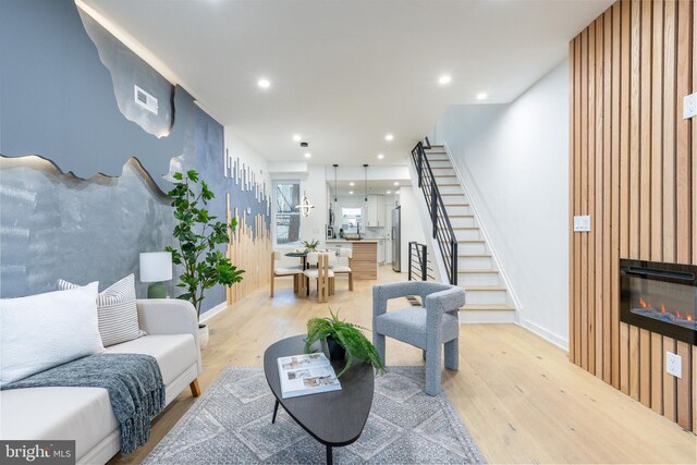 2074 E Birch St, Philadelphia, PA 19134 - living room featuring light wood-style floors, recessed lighting, stairs, and a fireplace