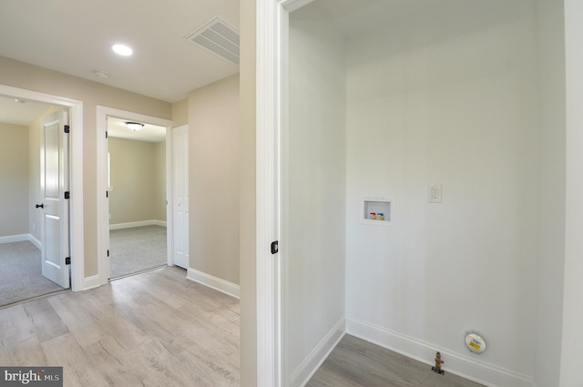 clothes washing area with visible vents, light wood-type flooring, baseboards, hookup for a washing machine, and recessed lighting