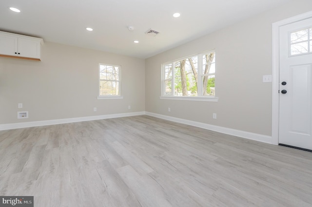entrance foyer featuring recessed lighting, plenty of natural light, and light wood finished floors