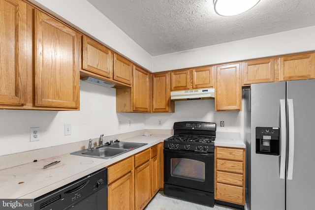 2033 S Anvil Ln, Temple Hills, MD 20748 - kitchen with black appliances, a sink, under cabinet range hood, a textured ceiling, and light countertops