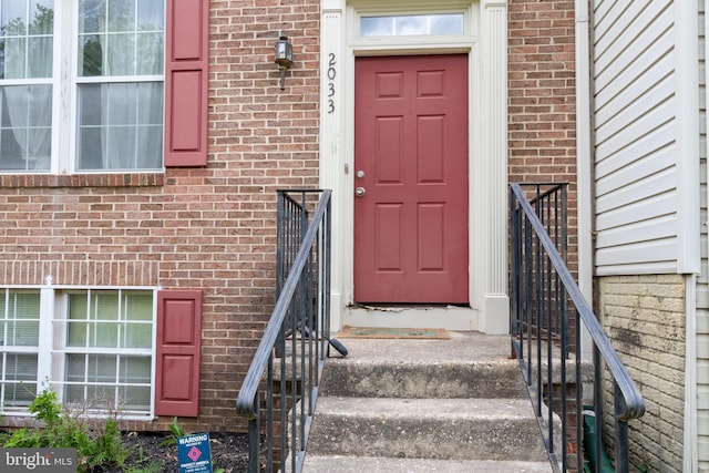 2033 S Anvil Ln, Temple Hills, MD 20748 - doorway to property featuring brick siding