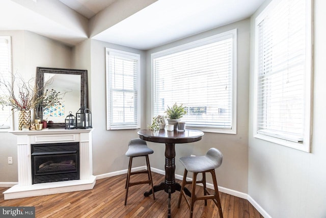 dining area featuring baseboards and wood finished floors