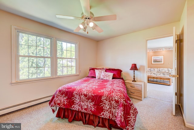 bedroom with carpet flooring, ceiling fan, and baseboard heating