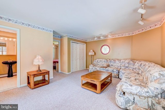 living room featuring carpet flooring and rail lighting
