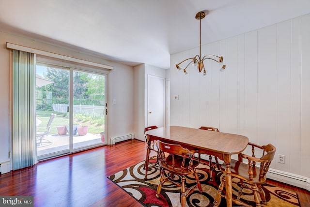 dining room with wood finished floors and a baseboard radiator