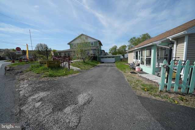view of street with aphalt driveway