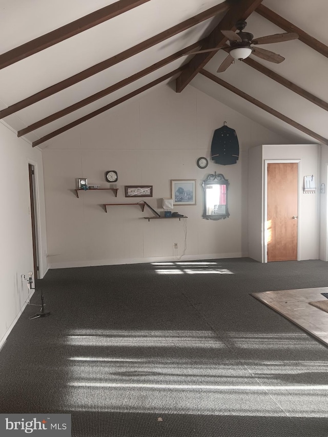 interior space with carpet floors, vaulted ceiling with beams, and ceiling fan