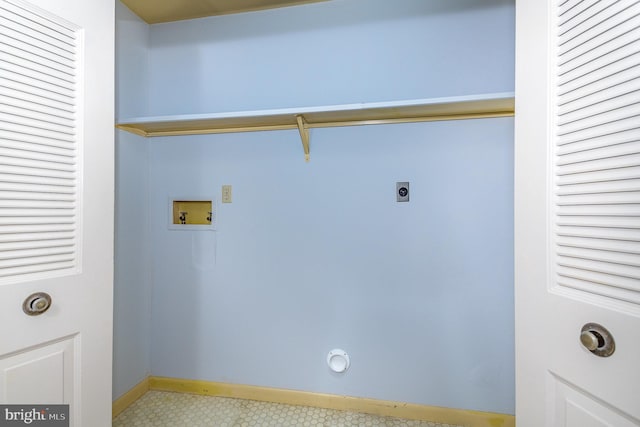 laundry area with baseboards, hookup for a washing machine, hookup for an electric dryer, and laundry area