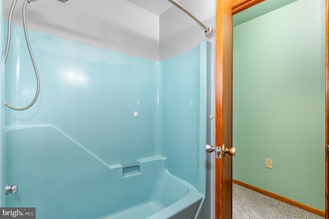 full bathroom with baseboards, a washtub, and walk in shower