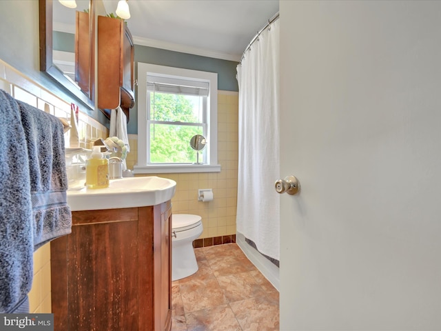 bathroom with vanity, crown molding, curtained shower, toilet, and tile walls