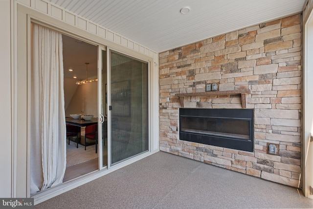 view of patio / terrace featuring a stone fireplace