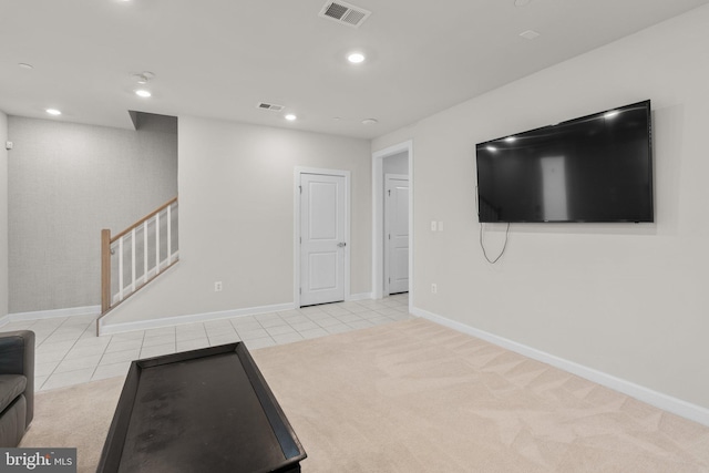 workout area featuring visible vents, baseboards, and tile patterned floors